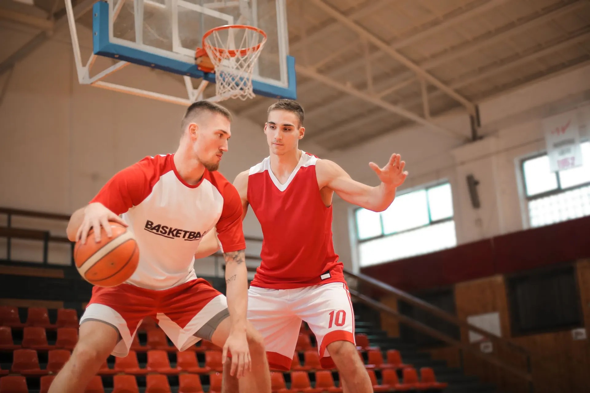 Two basketball players going one-on-one under the basket
