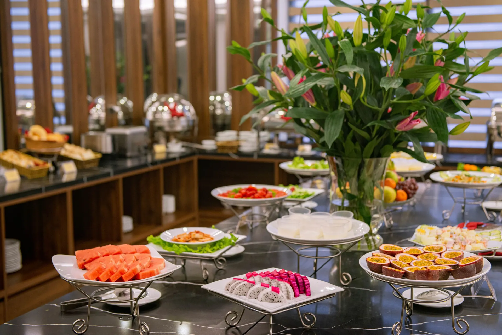 Hotel breakfast buffet with fresh fruit and salads