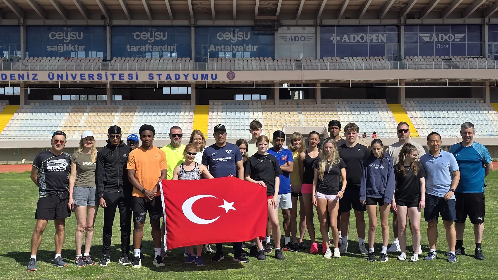 An international squad gathered on the infield of the stadium